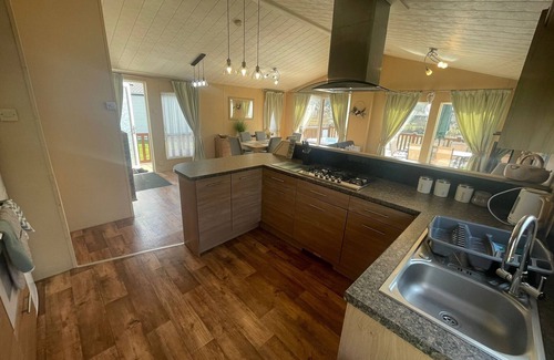 Tattershall Cabina | luxury lakeside lodge with a sunken hot tub on bull rush a peaceful feature lake @Tattershall lakes