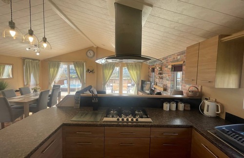 Tattershall Cabina | luxury lakeside lodge with a sunken hot tub on bull rush a peaceful feature lake @Tattershall lakes