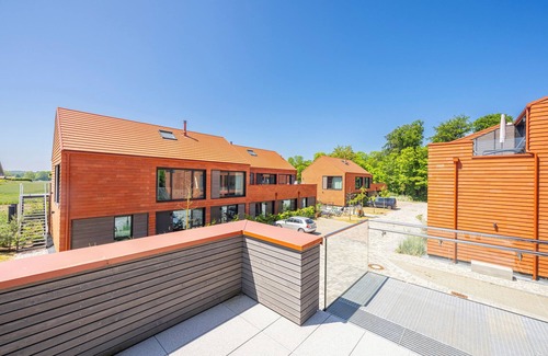 Hohwacht Apartamento | Luxury loft apartment with rooftop terrace and fireplace.