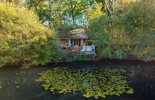 Earls Colne Cabina | Luxury secluded lakeside cabin with hot tub. Pet Friendly!