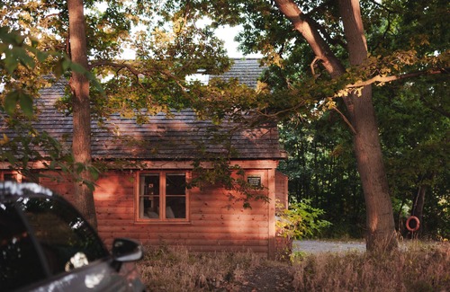 Earls Colne Cabina | Luxury secluded lakeside cabin with hot tub. Pet Friendly!