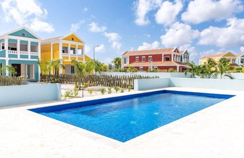 Tera Kora Casa | Luxury semi-detached water villa with 2 apartments, SUP boards, barbecue, and access to a shared pool, jacuzzi on the terrace (ground floor), and air conditioning in bedrooms and living room.