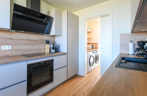 Marienleuchte Apartamento | Lykke vacation apartment - pure sea view. Sauna. Family-friendly.