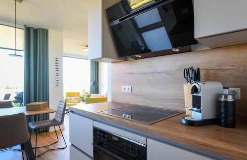 Marienleuchte Apartamento | Lykke vacation apartment - pure sea view. Sauna. Family-friendly.