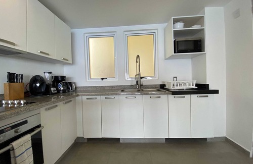 Brisas del Marqués Condominio | Magical sunsets, king bed, and pro service B403