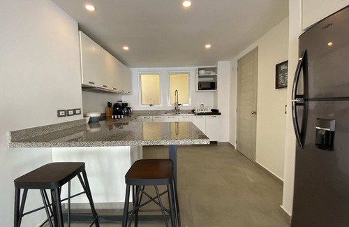 Brisas del Marqués Condominio | Magical sunsets, king bed, and pro service B403