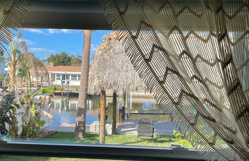 Dixie Shores Casa | Manatee Cove, Tiki WATERFRONT Home w/BOATLIFT
