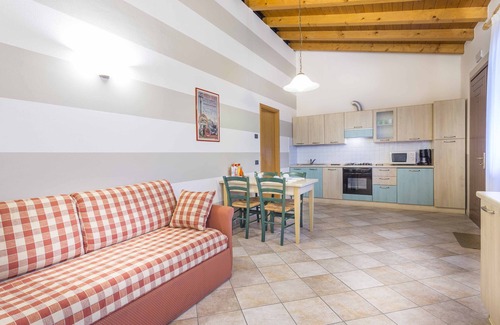 Palazzolo dello Stella Apartamento | Masorini1 toma un descanso, cerca de la piscina