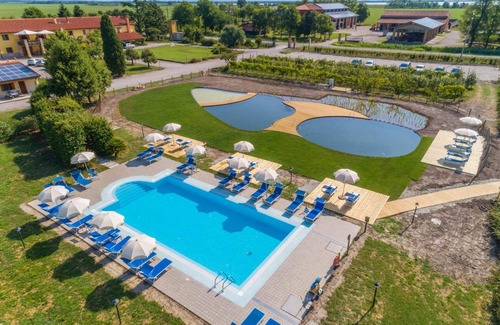 Palazzolo dello Stella Apartamento | Masorini1 toma un descanso, cerca de la piscina