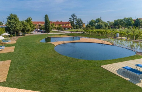 Palazzolo dello Stella Apartamento | Masorini1 toma un descanso, cerca de la piscina