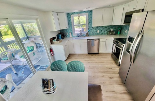 Chincoteague Casa | Mermaid & Mare, Downtown Retreat. Hot Tub, Firepit, fenced yard & Pet Friendly!