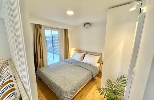 Olymbiaki Akti Casa | Minimalist Seaside Apartment with Private Patio and Parking - Blue Zone Homes
