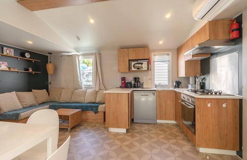 Ronce-les-Bains Alquiler De RV | Mobil Home 'Mh 428 Ronce Les Bains' con piscina compartida, terraza y aire acondicionado