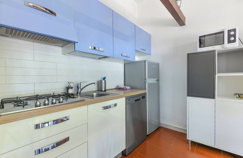 Lacona Apartamento | Moderno apartamento vacacional con jardín, aire acondicionado y Wi-Fi