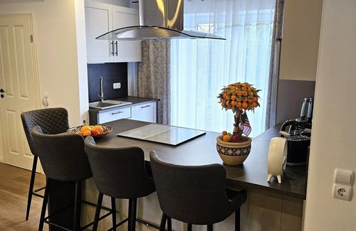 Midlum Apartamento | Modern and cozy vacation apartment on the North Sea, rural, quiet, with garden