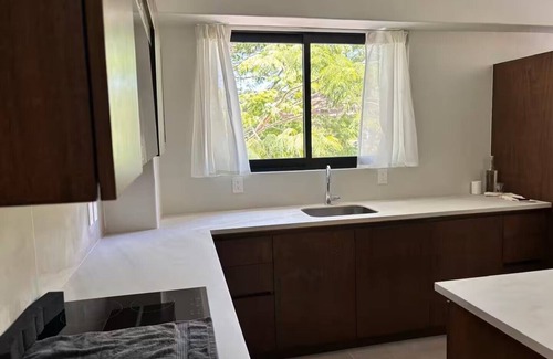 Playa Chahué Apartamento | Modern Apt with Pool - 5 Min walk to Chahue Beach