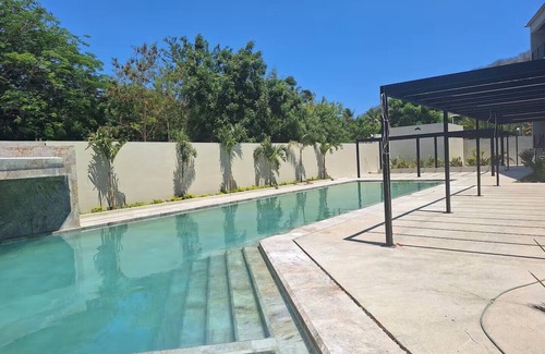 Playa Chahué Apartamento | Modern Apt with Pool - 5 Min walk to Chahue Beach