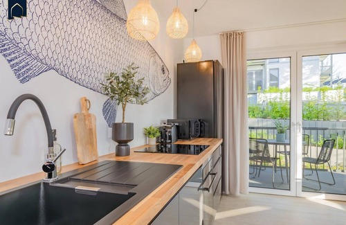 Koelpinsee Apartamento | Modern bluefish hut with balcony - only 800 m to the beach