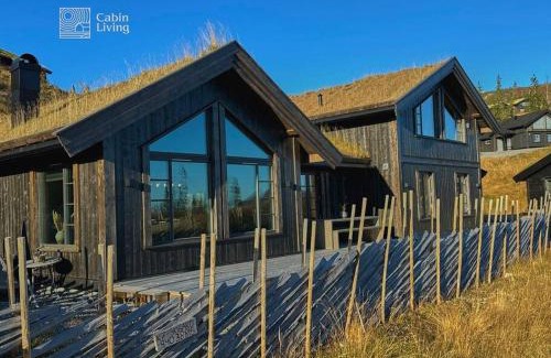 Fla Municipality Villa | Modern cabin at Høgevarde panoramic view, fireplace and EV station