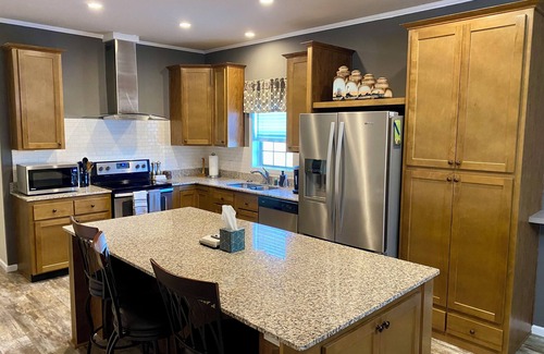 Marinette Casa | Modern Home on Trout Creek in Peshtigo “Fire City” w/ Spacious Backyard & Deck!