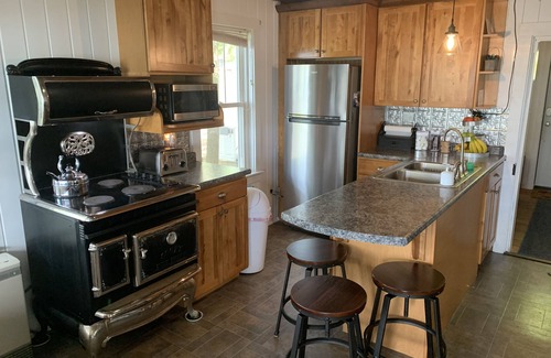 Oakland Cabaña | Modern Lakefront Camp on East Pond - cozy fire pit, 3 kayaks, canoe