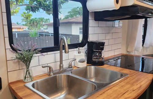 Homestead Casa | Modern mobile home with pool and private patio.