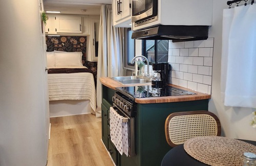 Homestead Casa | Modern mobile home with pool and private patio.