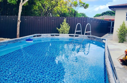Homestead Casa | Modern mobile home with pool and private patio.