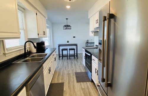 Kansas City Casa | Modern Oasis Near the Legends - Spacious home with games, patio, deck and more!