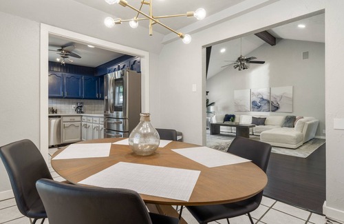 South Tulsa Casa | Modern space in south Tulsa w/ outdoor firepit, kitchen, turf, & string lights!