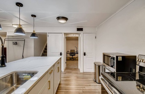 Harvey Park Condominio | Modern suite w/ yard and off-street parking!