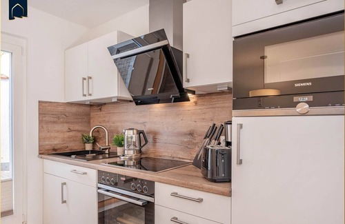 Kamminke Apartamento | Modern vacation apartment by the lake with terrace and garden view on Usedom