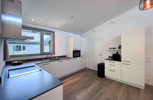 Dirkshorn Casa | Villa moderna con terraza y jardín en Dirkshorn