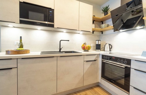 Dorumer Neufeld Apartamento | Moderne Ferienwohnung mit Balkon und Sauna in Strandnähe