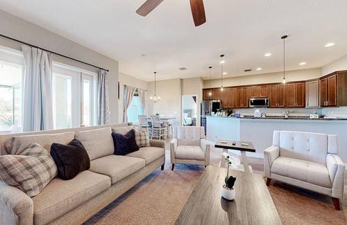 Plant City Casa | Modernly updated open home with lake view, screened-in patio, grill, AC, & W/D