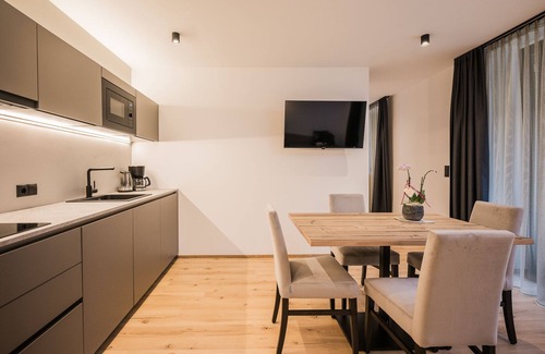 Villabassa Apartamento | Montanaris Alpine~Active~RelaxThe base camp with pool and saunas in the Dolomites.