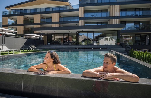 Villabassa Apartamento | Montanaris Alpine~Active~RelaxThe base camp with pool and saunas in the Dolomites.