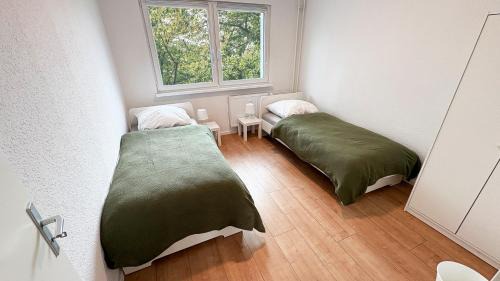 Stadtbezirk West Apartamento | Monteurwohnungen mit TV, Internet, Parkplatz, Waschmaschine, Küche, Balkon, Restaurants und Supermarkt
