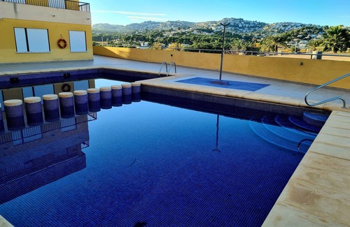 Paichi Apartamento | Moraira Town Centre Apartment with Communal Pool & Gardens.