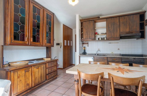 Barzio Apartamento | Mountain lodging with fireplace and mountain view