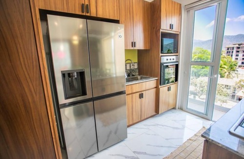 Fluvial Vallarta Apartamento | Mountain view Condo + infinity rooftop Pool in foodie district. Fast WiFi