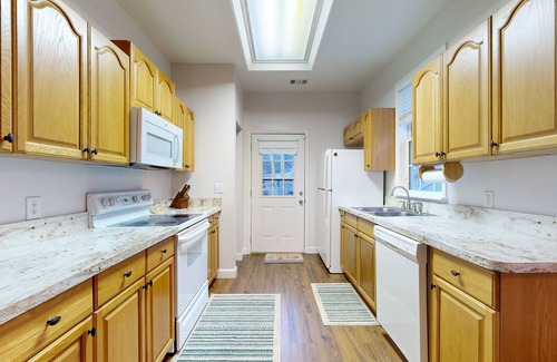 Sylva Casa | Mountain view home with a fireplace with beautiful view of the creek