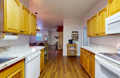 Sylva Casa | Mountain view home with a fireplace with beautiful view of the creek