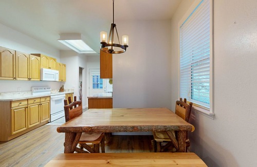 Sylva Casa | Mountain view home with a fireplace with beautiful view of the creek