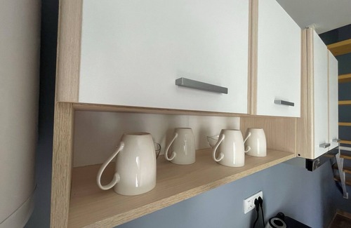 Becej Apartamento | Enchanting apartment complex with a stunning yard, gym, and sports equipment.