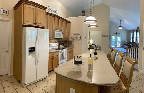 Camdenton Casa | Nestled by the 7th green, large deck areas. Movie theatre for inside or out.