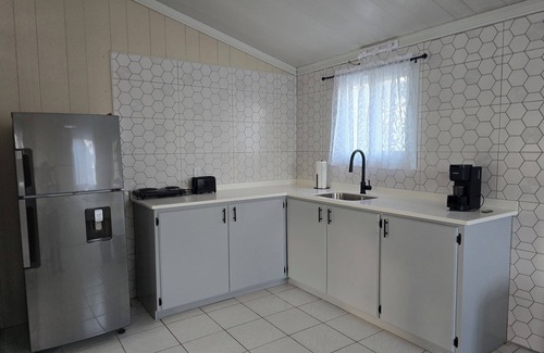 Saint John Parish Casa | Nestled 2-bedroom home in quiet neighborhood with WiFi, AC, fitness room
