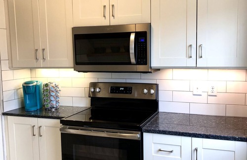 Dubuque Casa | NEW Central Air!! Cute, family home, large fenced backyard and patio area!