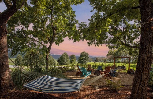 Brevard Cabaña | Tiki bar cottage with largest porch in NC and hot tub, views and fire pit!