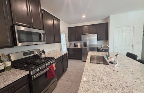 North Las Vegas Casa | New Gated Luxury: Modern gated 2 bed 2 bath home with soaking Tub, Patio, BBQ.